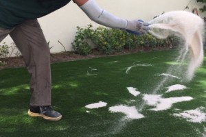 Applying white silica to fake grass