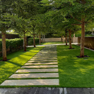 Installed artificial grass in between pavers