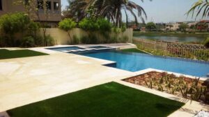 Installed artificial grass on residential property beside pool
